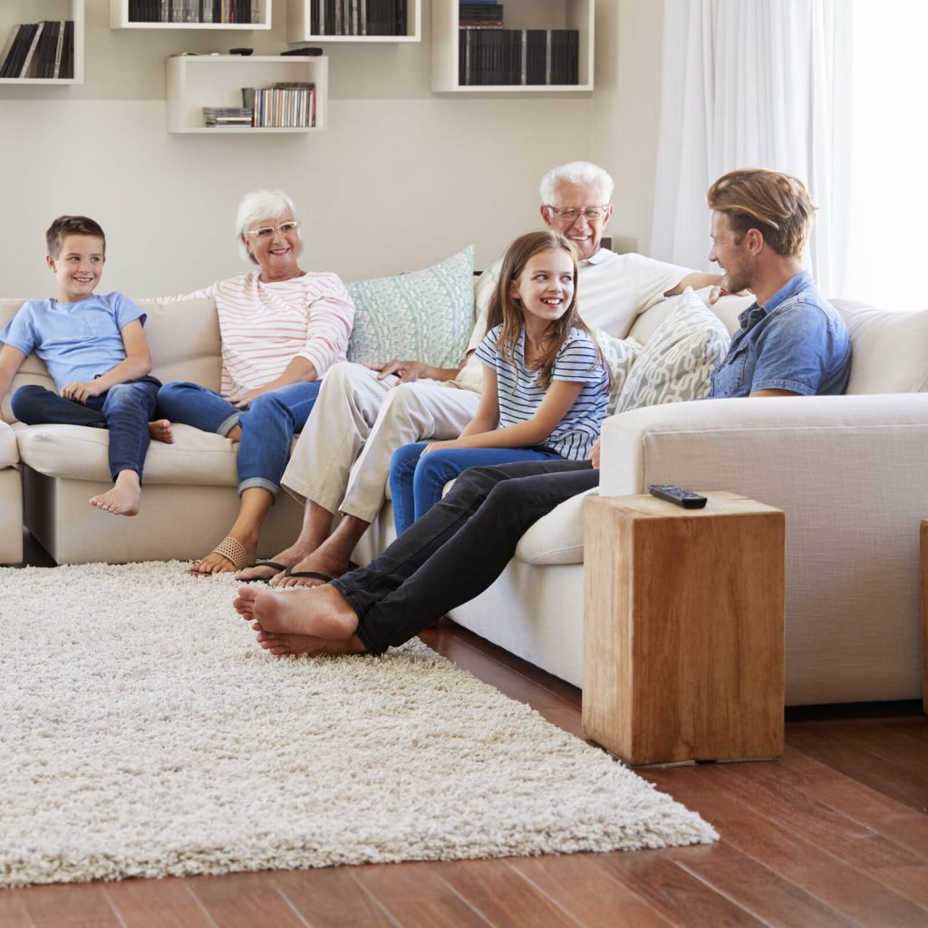 Family gosping in living room | Shoreline Flooring