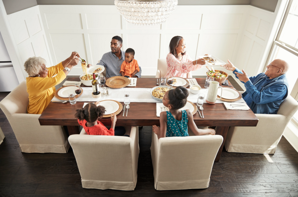 Family having breakfast at the dining table | Shoreline Flooring