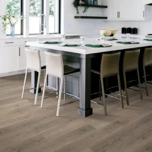 33619_958_room Mohawk Laminate in a gray-brown wood tone in a modern kitchen | Shoreline Flooring
