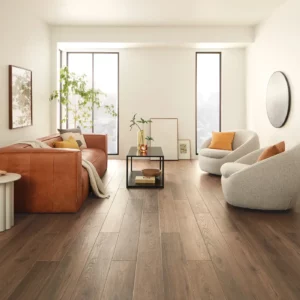 VV735_03018_ROOM COREtec Luxury Vinyl in a dark brown wood tone in a bright living room | Shoreline Flooring