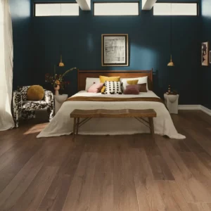 VV810_04027_ROOM COREtec Luxury Vinyl in a medium brown wood tone in a bedroom | Shoreline Flooring